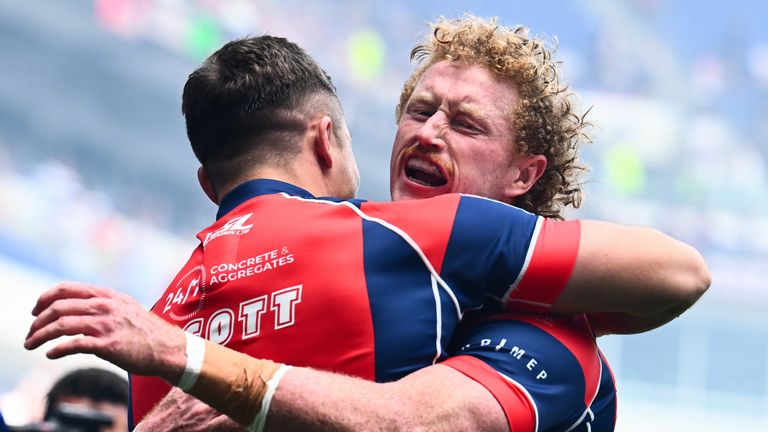 Picture by Olly Hassell/SWpix.com - 05/07/2026 - Rugby League - Betfred Super League Round 17: Magic Weekend - Wakefield Trinity v Castleford Tigers - Hill Dickinson Stadium, Liverpool, England - Cam Scott of Wakefield celebrating his try with Lachlan Walmsley of Wakefield